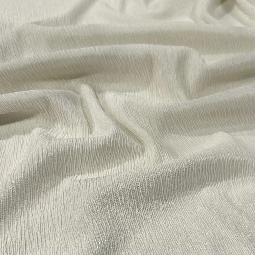 Bella Crepe Table Linen in Ivory