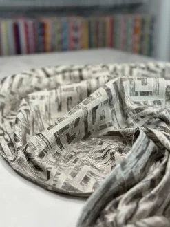 Gio Jacquard Table Linen in Taupe