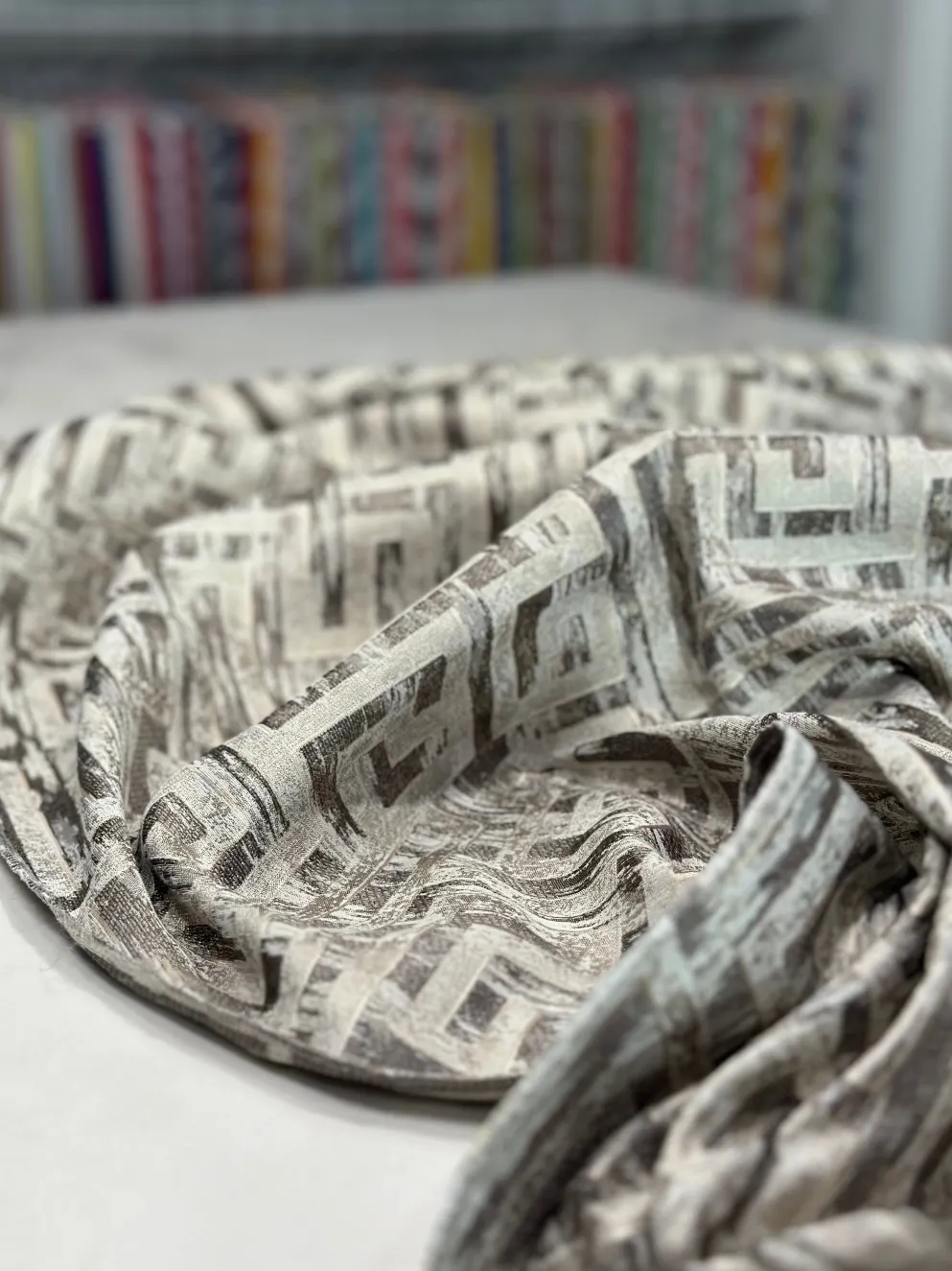 Gio Jacquard Table Linen in Taupe