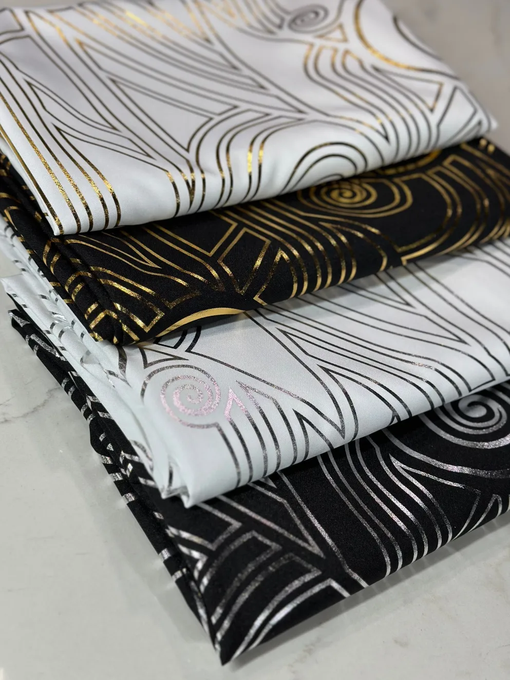 Luxor (Metallic Print) Table Linen in Black and Gold