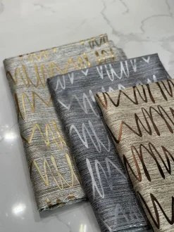 Zion Jacquard Table Linen in Gold